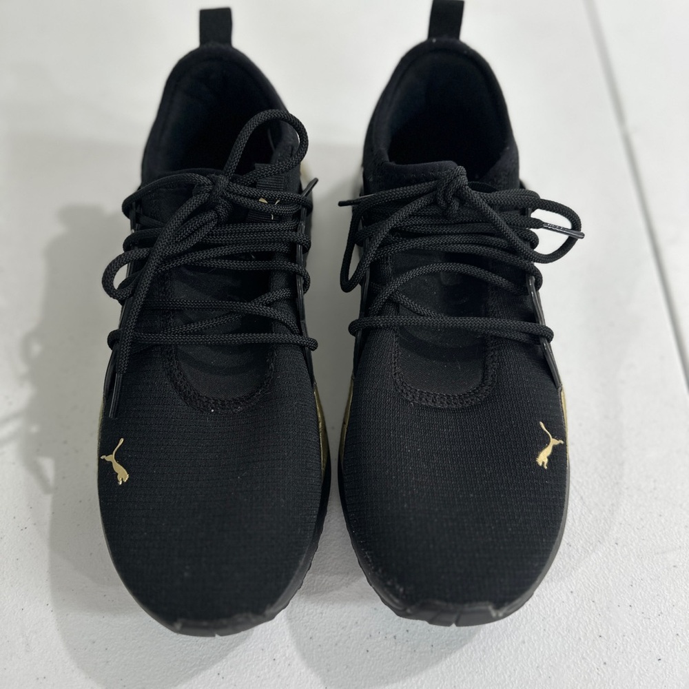 Ladies size 9.5 Puma Black and Gold Sneakers - wore once